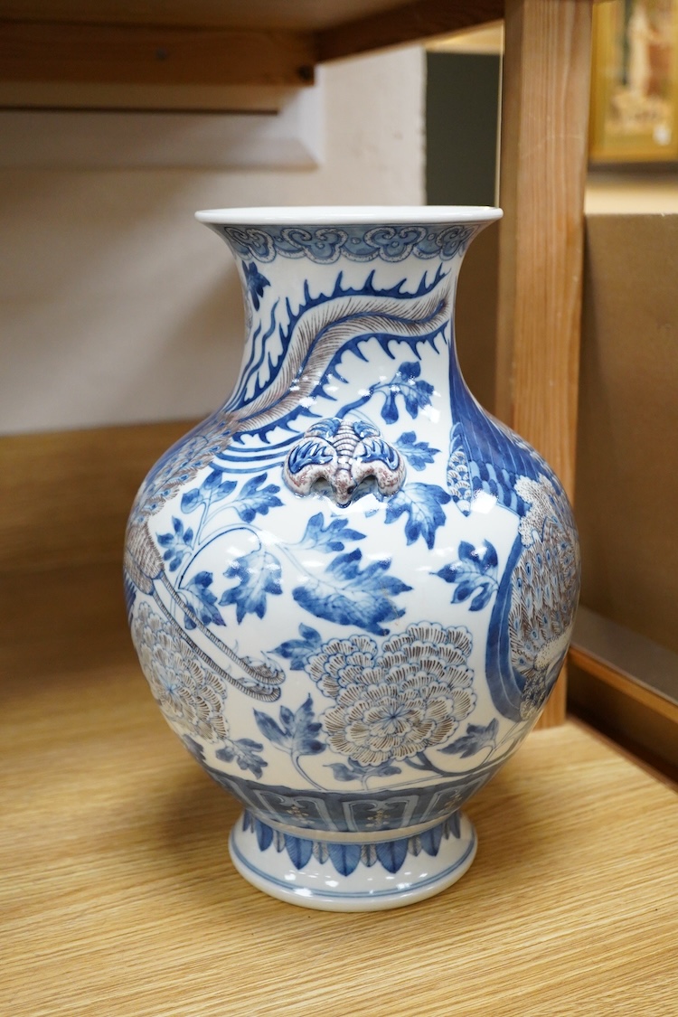 A Chinese underglaze blue and copper red baluster vase, 32cm high
